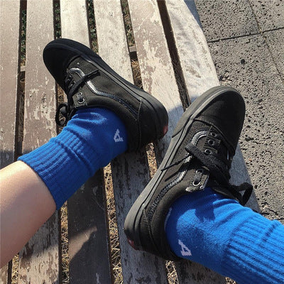 All black canvas shoes tide